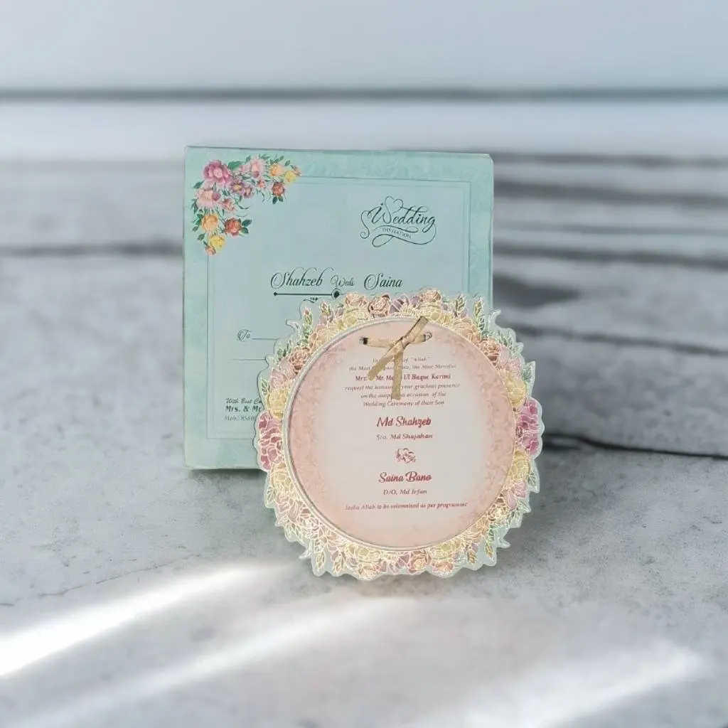 A beautiful green wedding card with a pink floral design curton card like MDF cards.