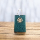 A Bag Style Card With Gold Medallion On It.