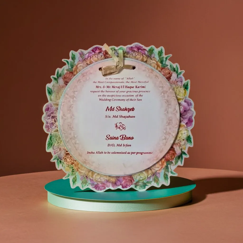 A beautiful green wedding card with a pink floral design like MDF cards.  