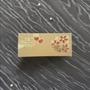 A Cream Wedding Card With Red And Golden Design On It