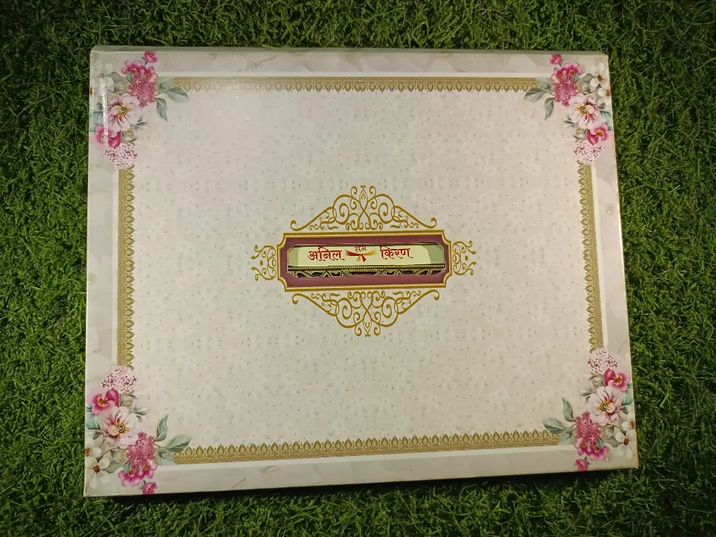 A Beautiful Wedding Card with name plate and strips